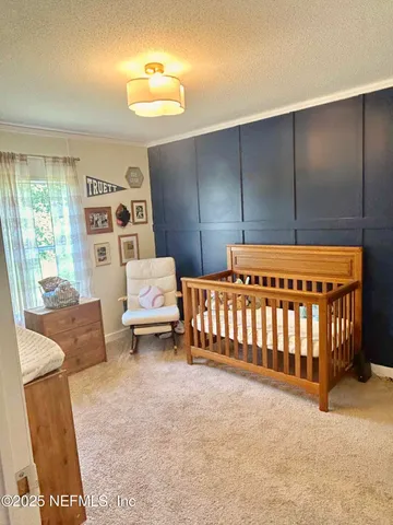 a view of field with trees in the background