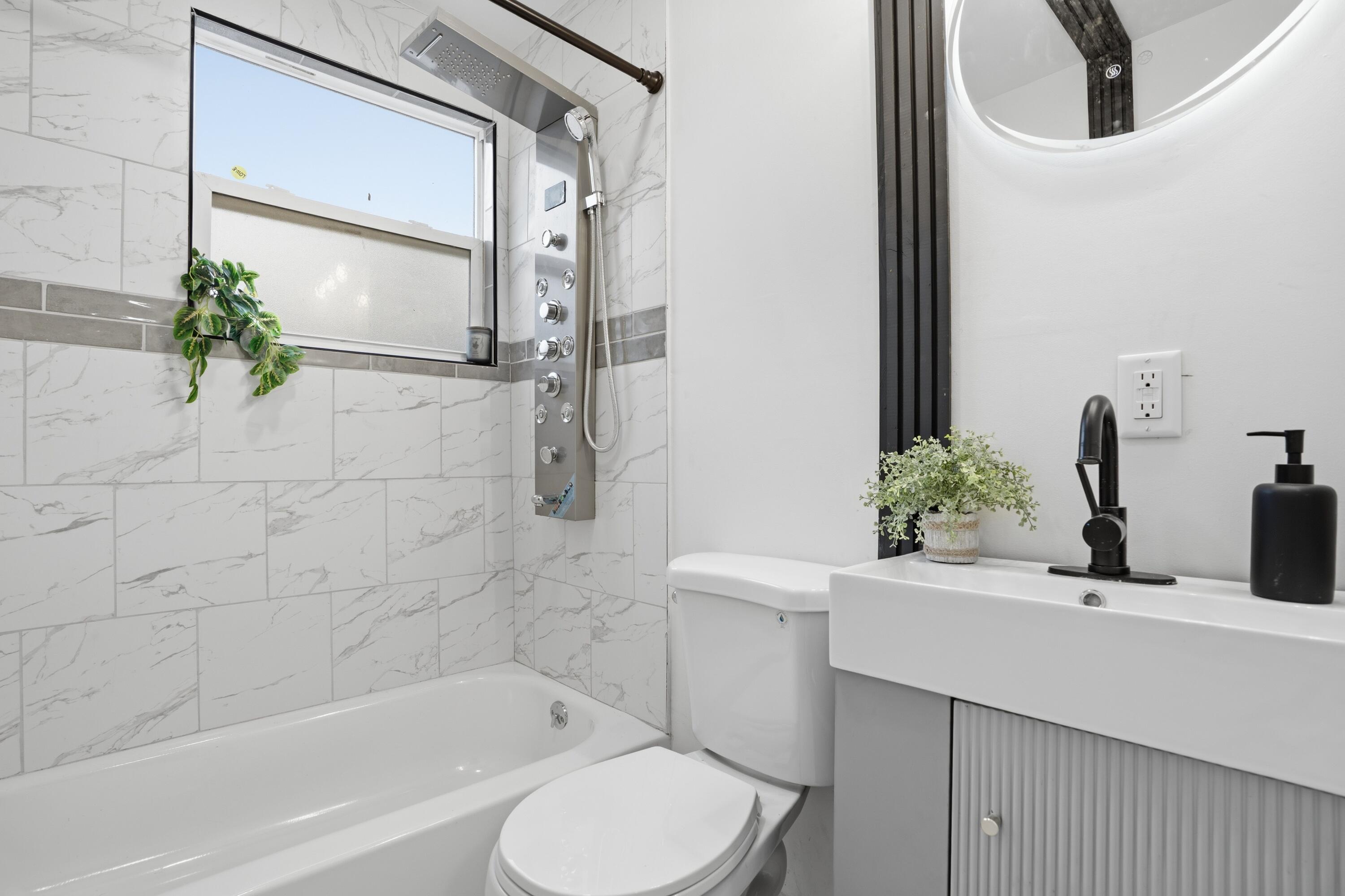2314 Kentucky Street Gary, IN 46407 - Photo 13 of 16 a bathroom with a sink toilet and shower