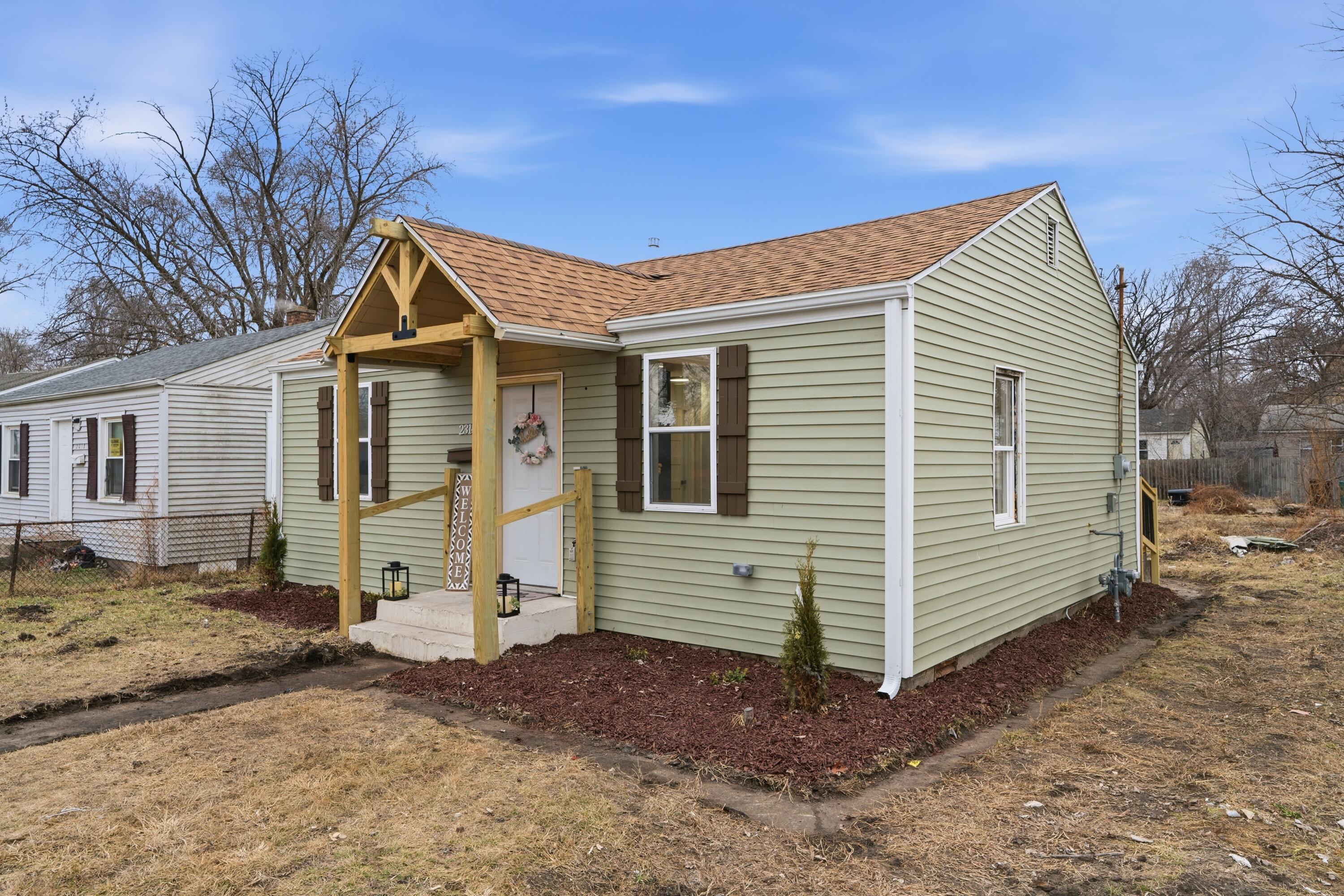 2314 Kentucky Street Gary, IN 46407 - Photo 15 of 16 a view of a house with a yard