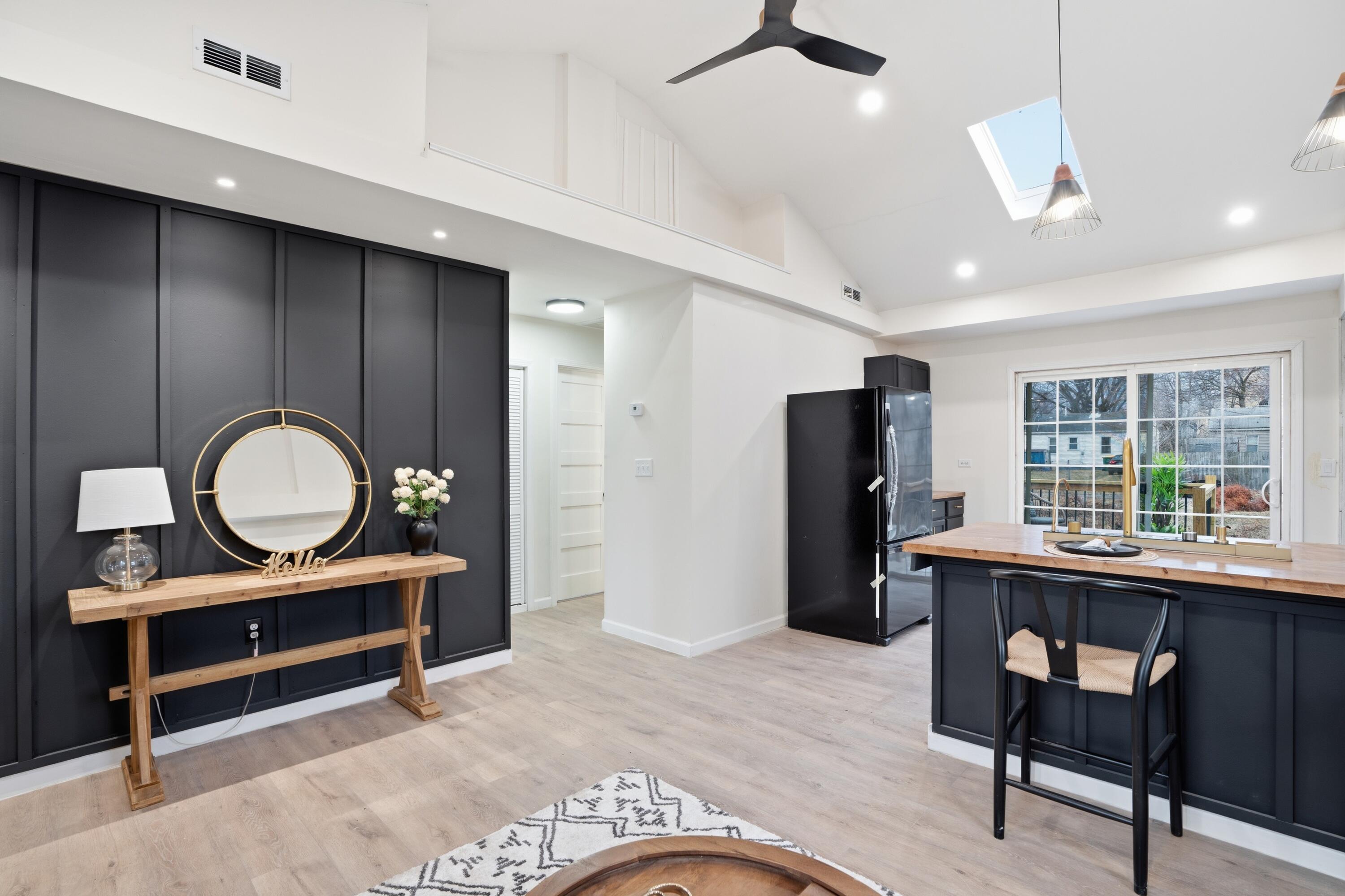2314 Kentucky Street Gary, IN 46407 - Photo 4 of 16 a living room with furniture a window and a chandelier