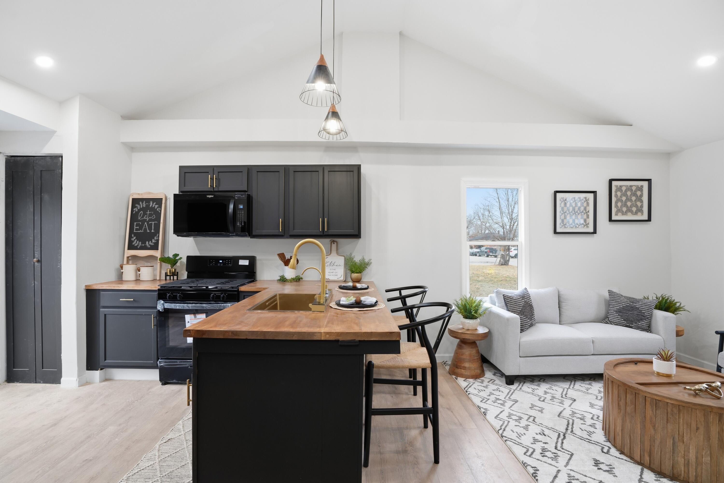 2314 Kentucky Street Gary, IN 46407 - Photo 6 of 16 a living room with furniture and a flat screen tv