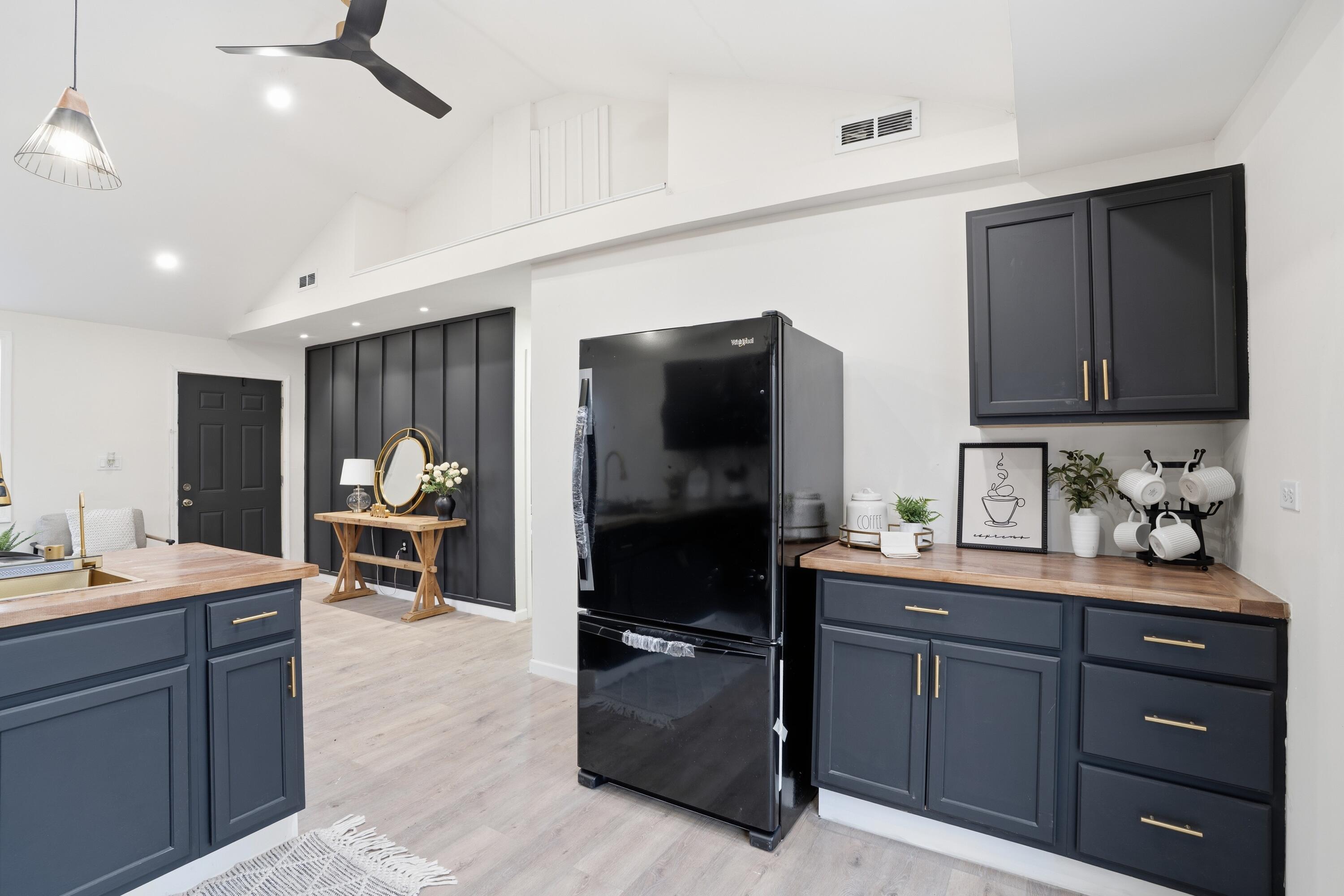 2314 Kentucky Street Gary, IN 46407 - Photo 8 of 16 a kitchen with a refrigerator and a sink
