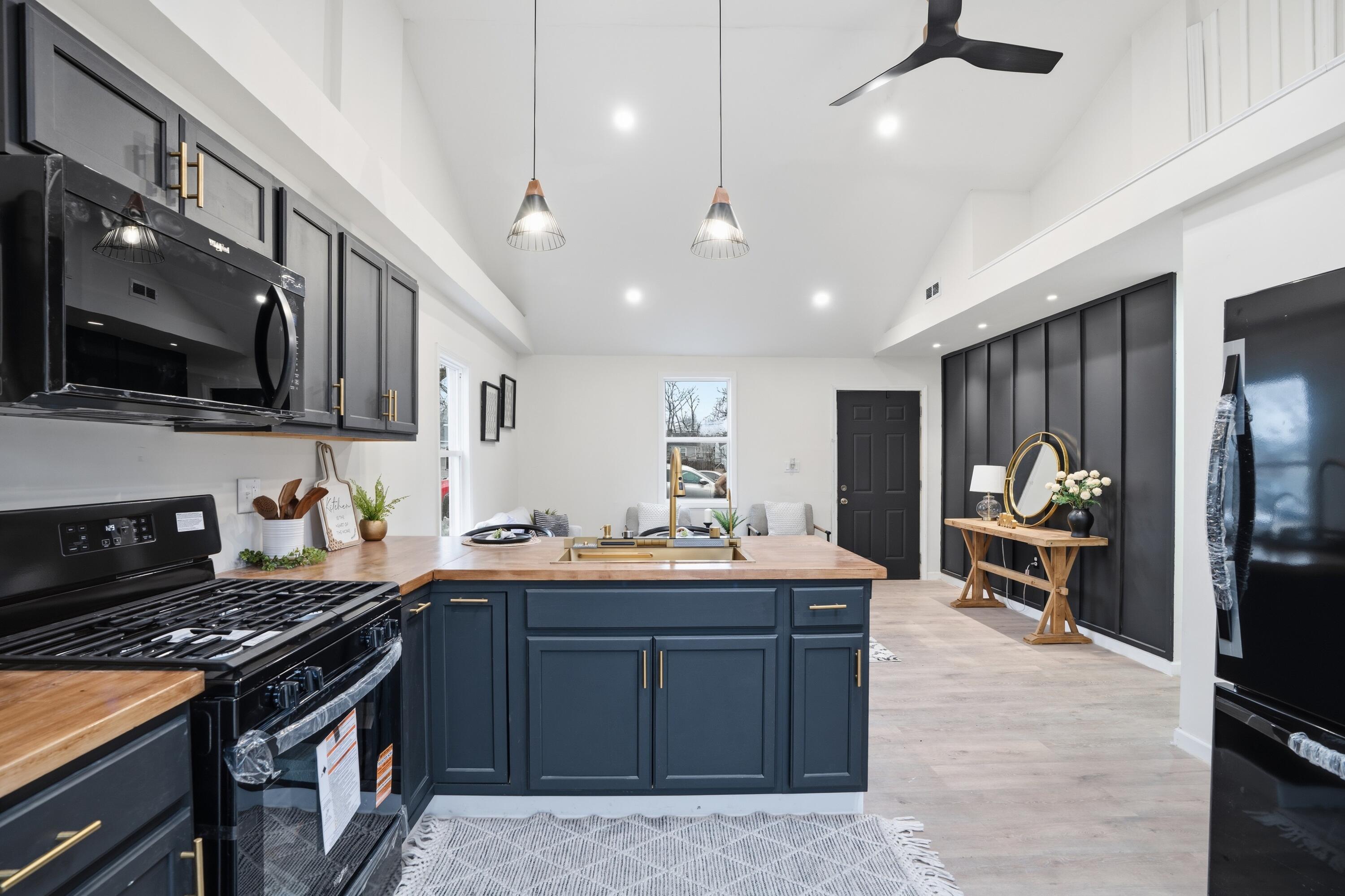 2314 Kentucky Street Gary, IN 46407 - Photo 9 of 16 a kitchen with a stove and a sink