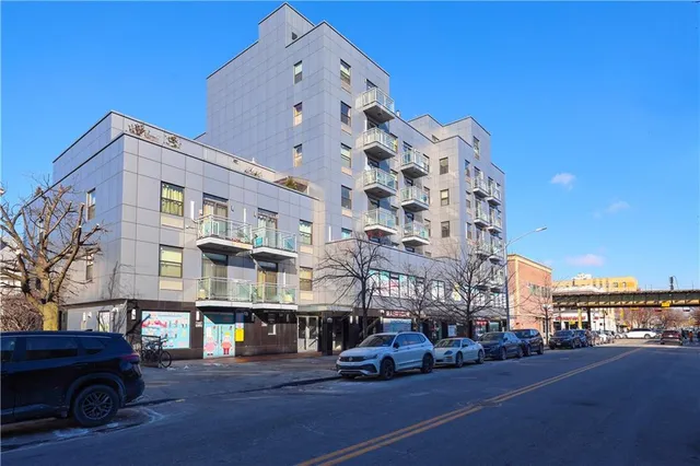 a city street lined with buildings and cars