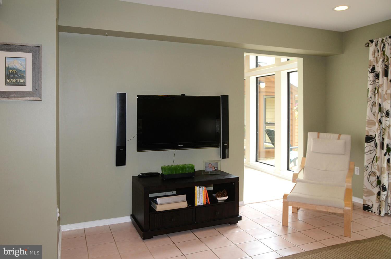 11030 Solaridge Drive Reston, VA 20191 - Photo 15 of 30 a living room with fireplace furniture and a flat screen tv