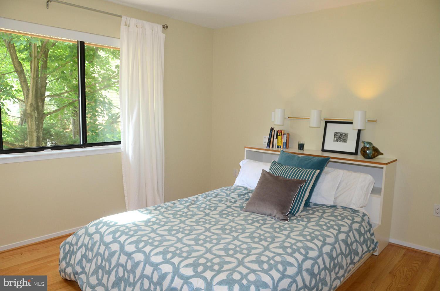 11030 Solaridge Drive Reston, VA 20191 - Photo 24 of 30 a bedroom with a bed and window
