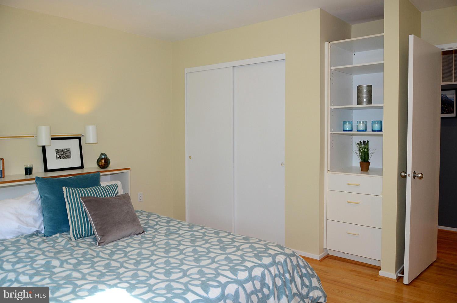 11030 Solaridge Drive Reston, VA 20191 - Photo 25 of 30 a bedroom with a bed and cabinets