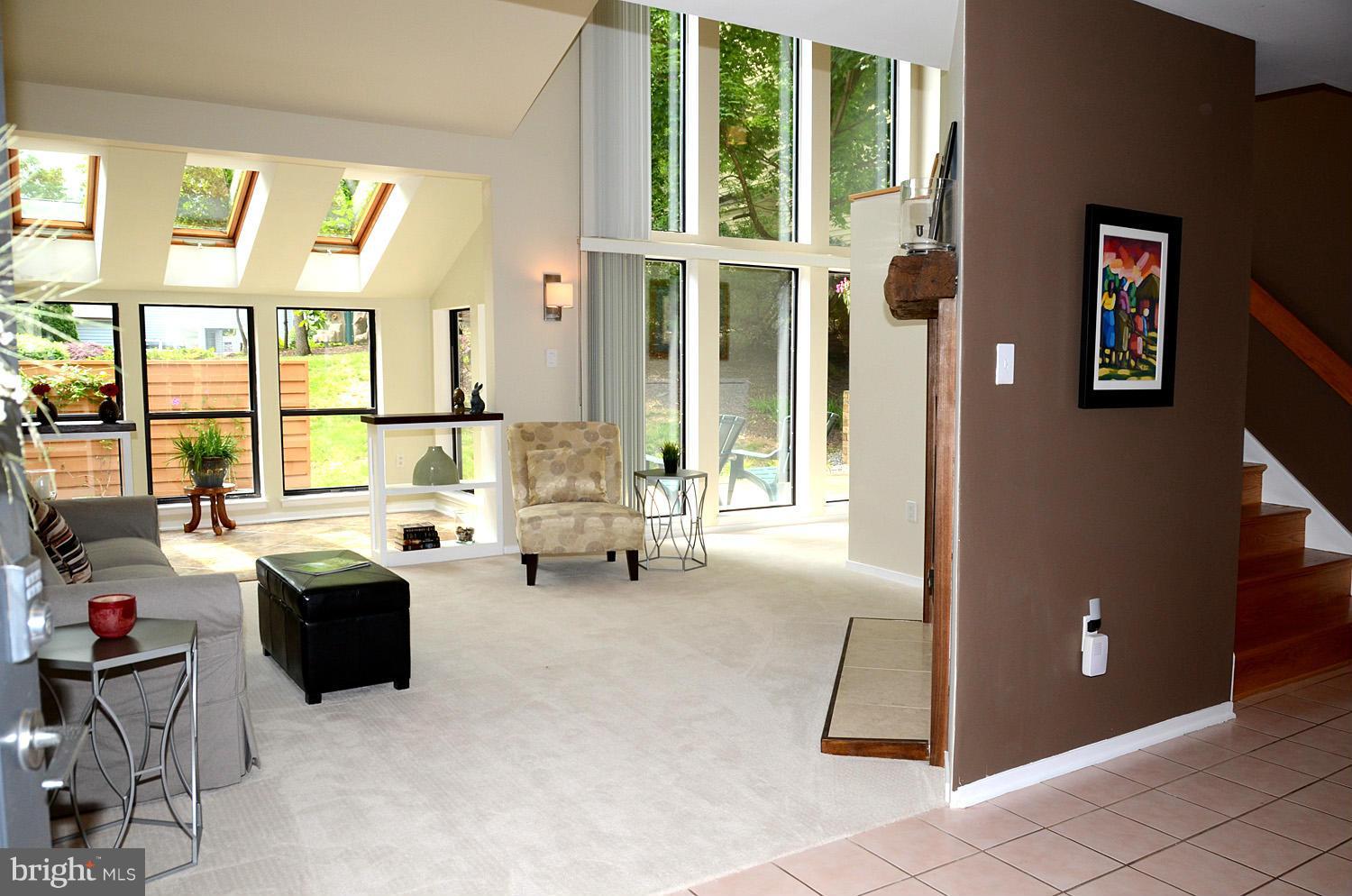 11030 Solaridge Drive Reston, VA 20191 - Photo 4 of 30 a living room with furniture and large windows