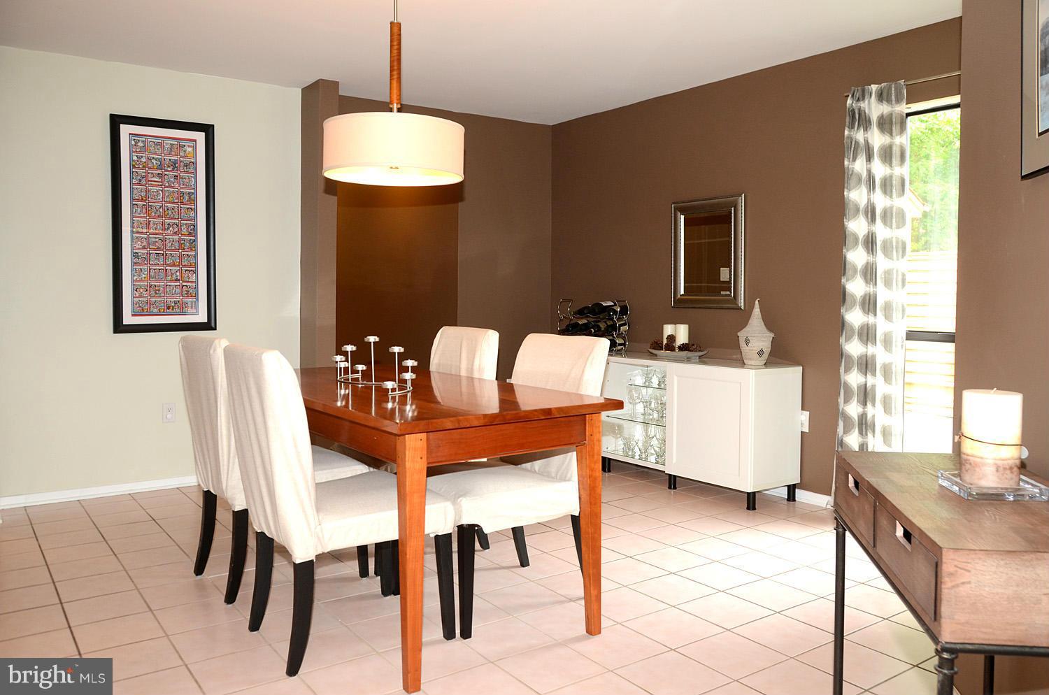 11030 Solaridge Drive Reston, VA 20191 - Photo 9 of 30 a dining room with furniture and window