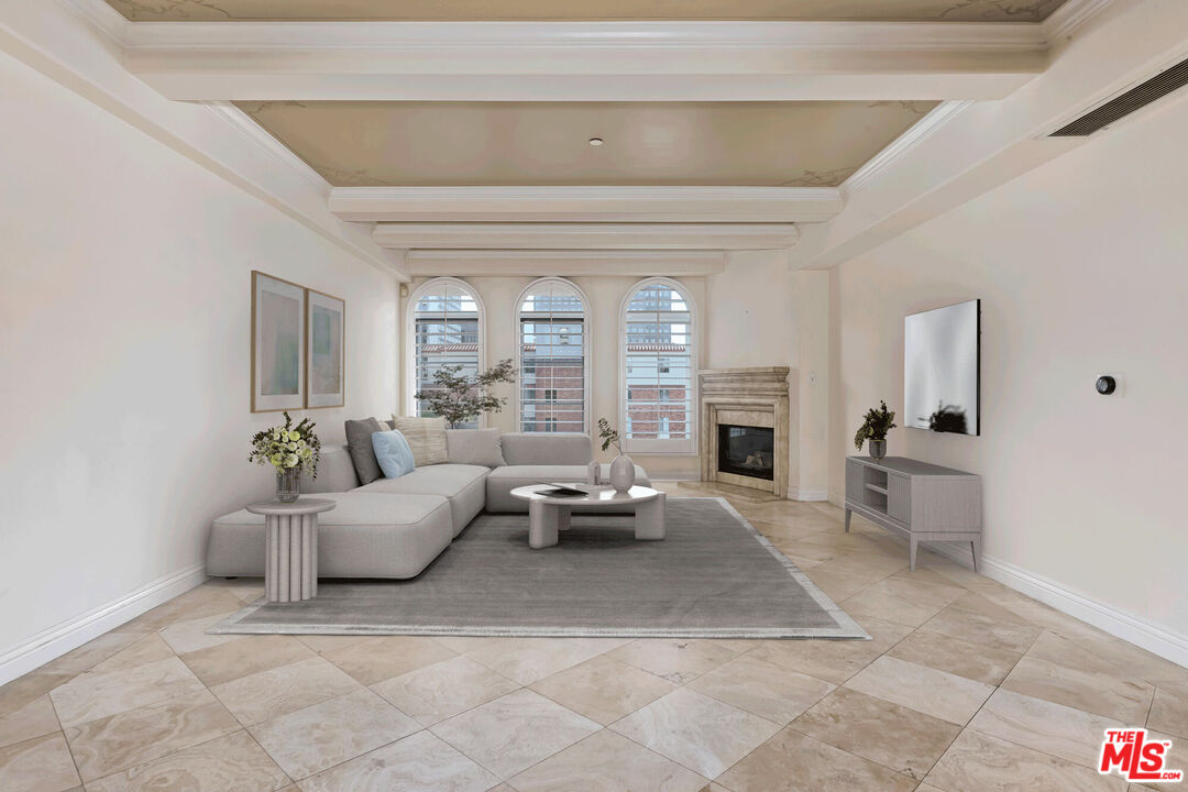 10795 Wilshire Boulevard, Unit 403 Los Angeles, CA 90024 - Photo 2 of 27 a living room with furniture and a fireplace