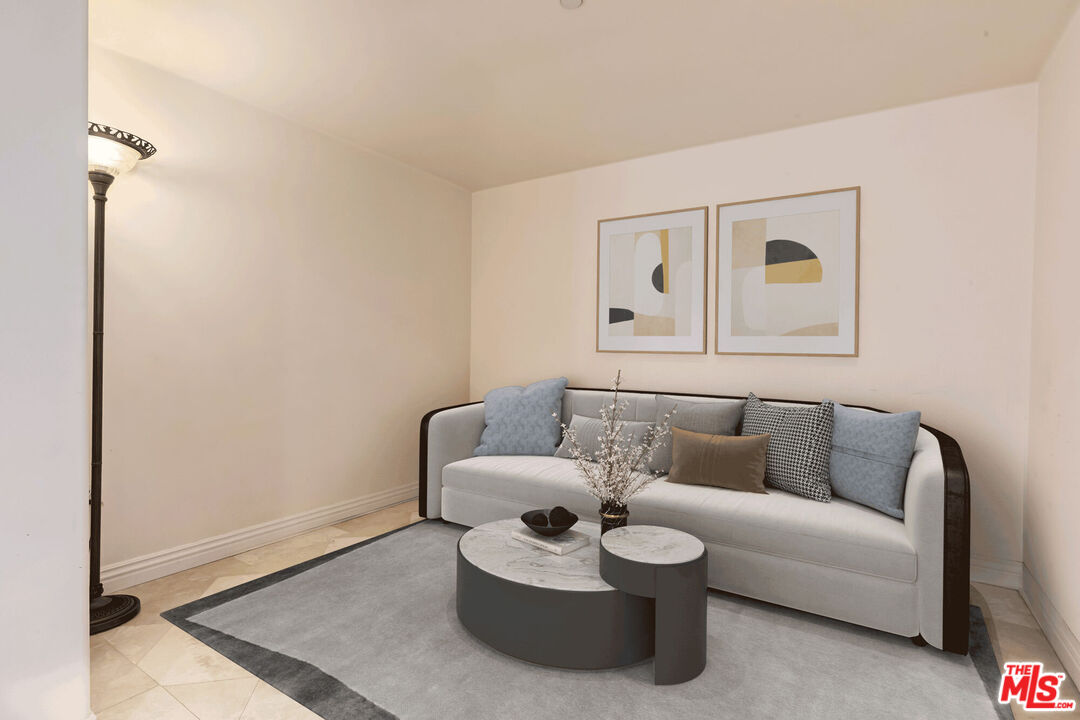 10795 Wilshire Boulevard, Unit 403 Los Angeles, CA 90024 - Photo 6 of 27 a living room with furniture and a window