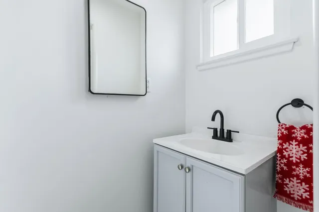 a view of a house with backyard and a sitting area