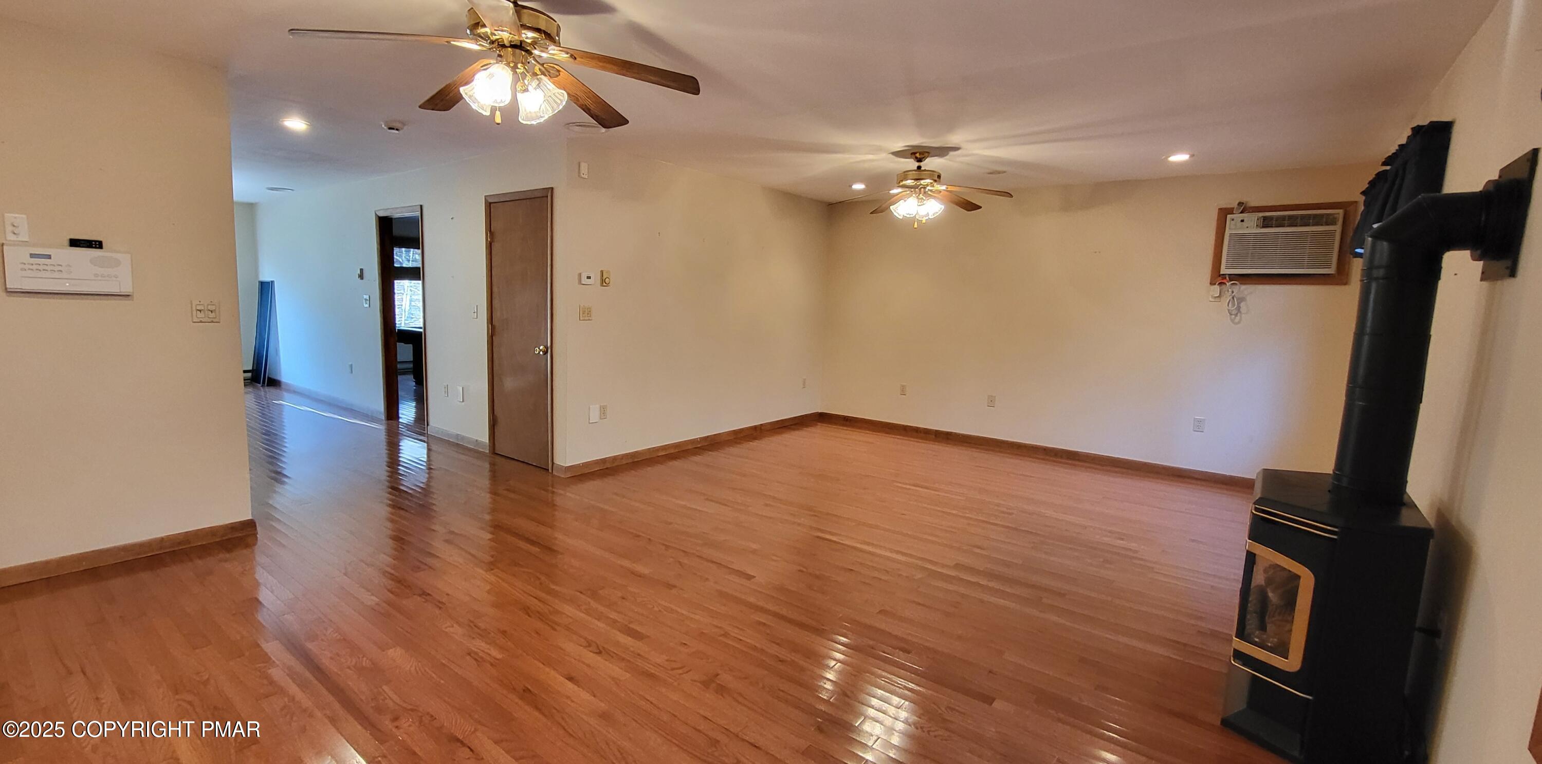 228 Edinburgh Road Bushkill, PA 18324 - Photo 18 of 77 a view of empty room with wooden floor