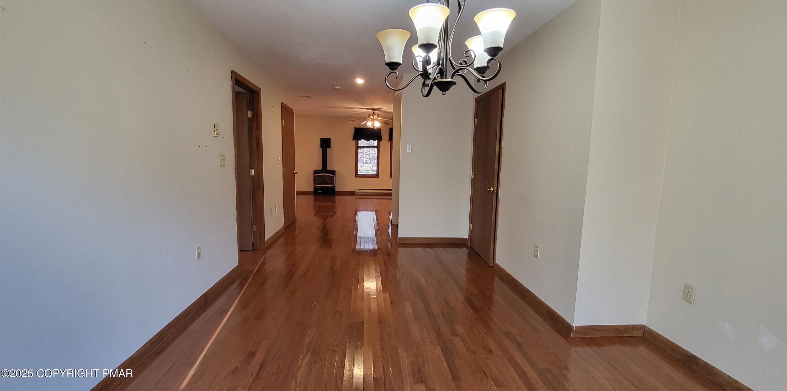 228 Edinburgh Road Bushkill, PA 18324 - Photo 26 of 77 a view of a livingroom with wooden floor