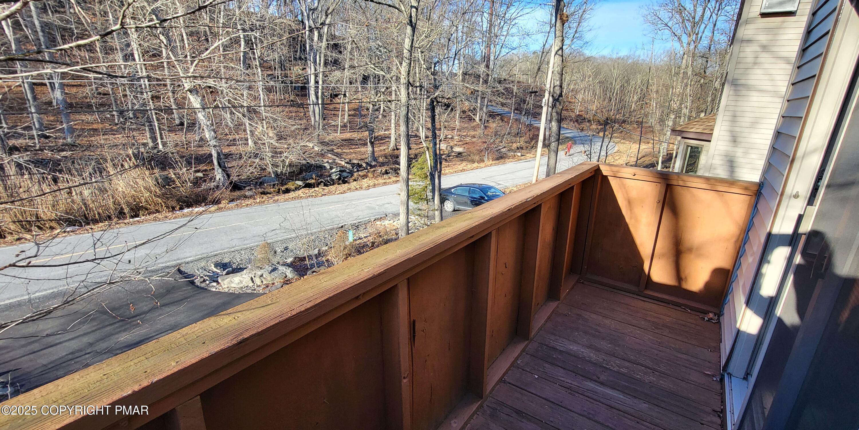 228 Edinburgh Road Bushkill, PA 18324 - Photo 47 of 77 a view of balcony with wooden floor and fence