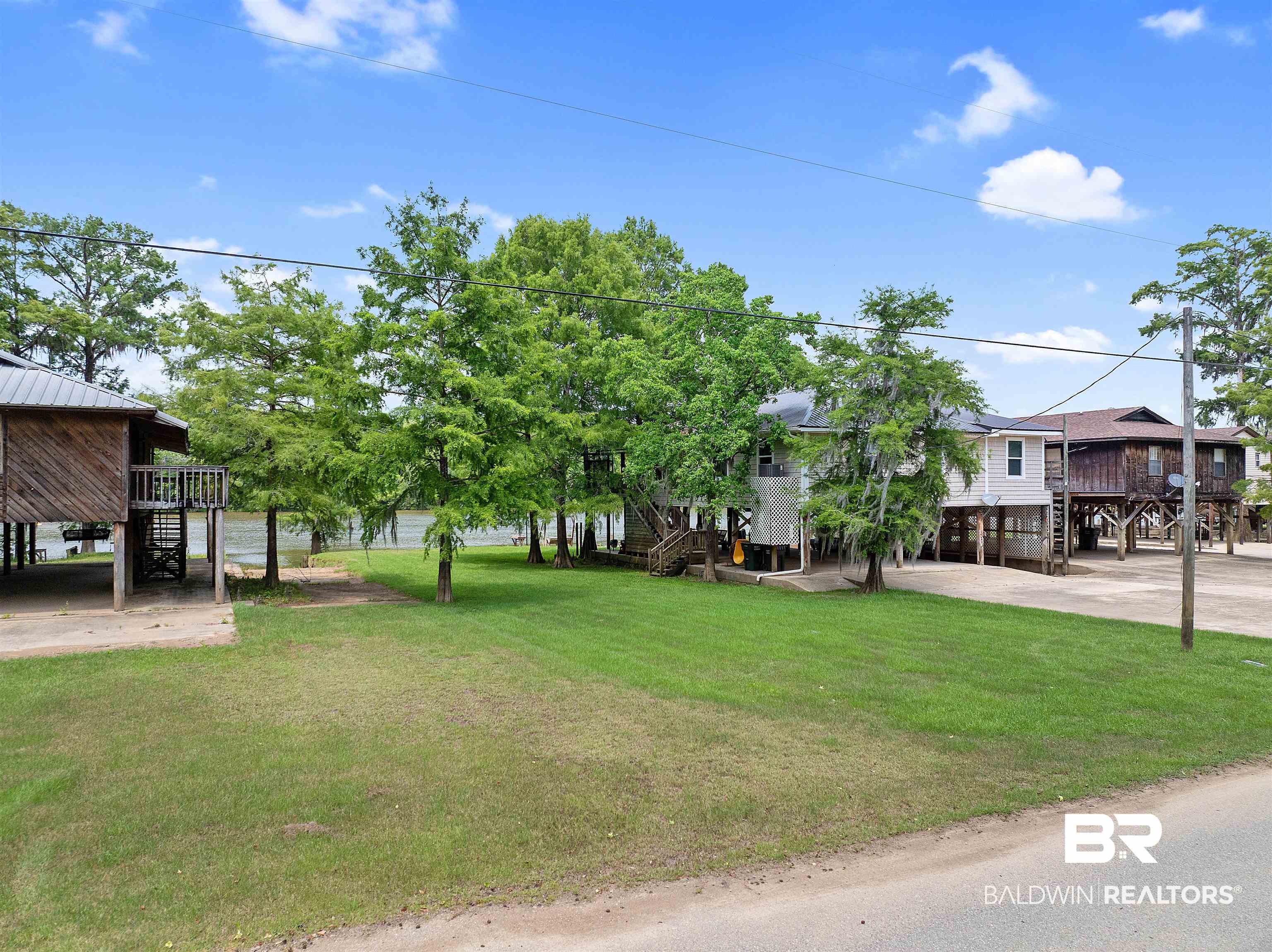 8157 Bryant's Lndg Road Stockton, AL 36579 - Photo 10 of 23 View of yard featuring a deck