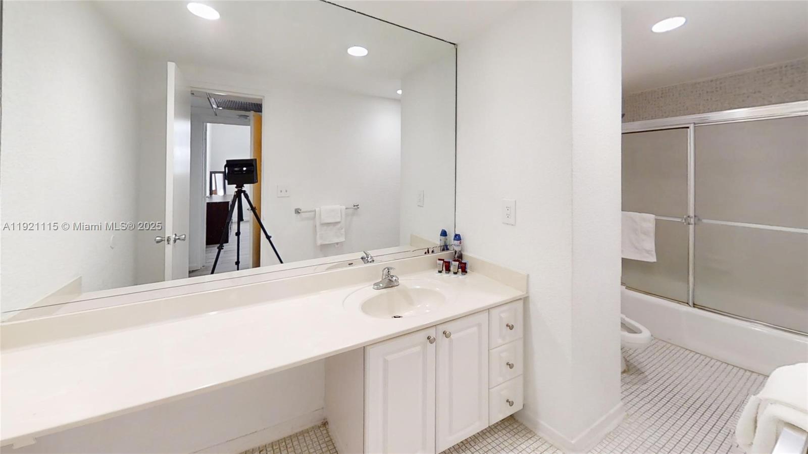 4001 South Ocean Drive, Unit PH7 Hollywood, FL 33019 - Photo 14 of 14 a en suite bathroom with a sink and a mirror