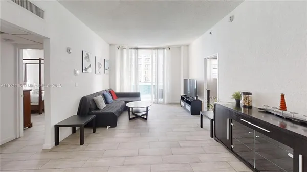 a living room with furniture and a window