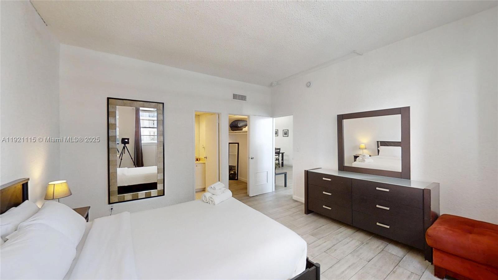 4001 South Ocean Drive, Unit PH7 Hollywood, FL 33019 - Photo 8 of 14 a bedroom with a bed and a couch