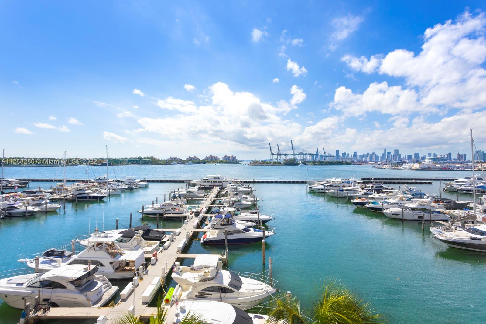 90 Alton Road, Unit 4 Miami Beach, FL 33139 - Photo 16 of 20 a view of a lake with boats and trees in the background