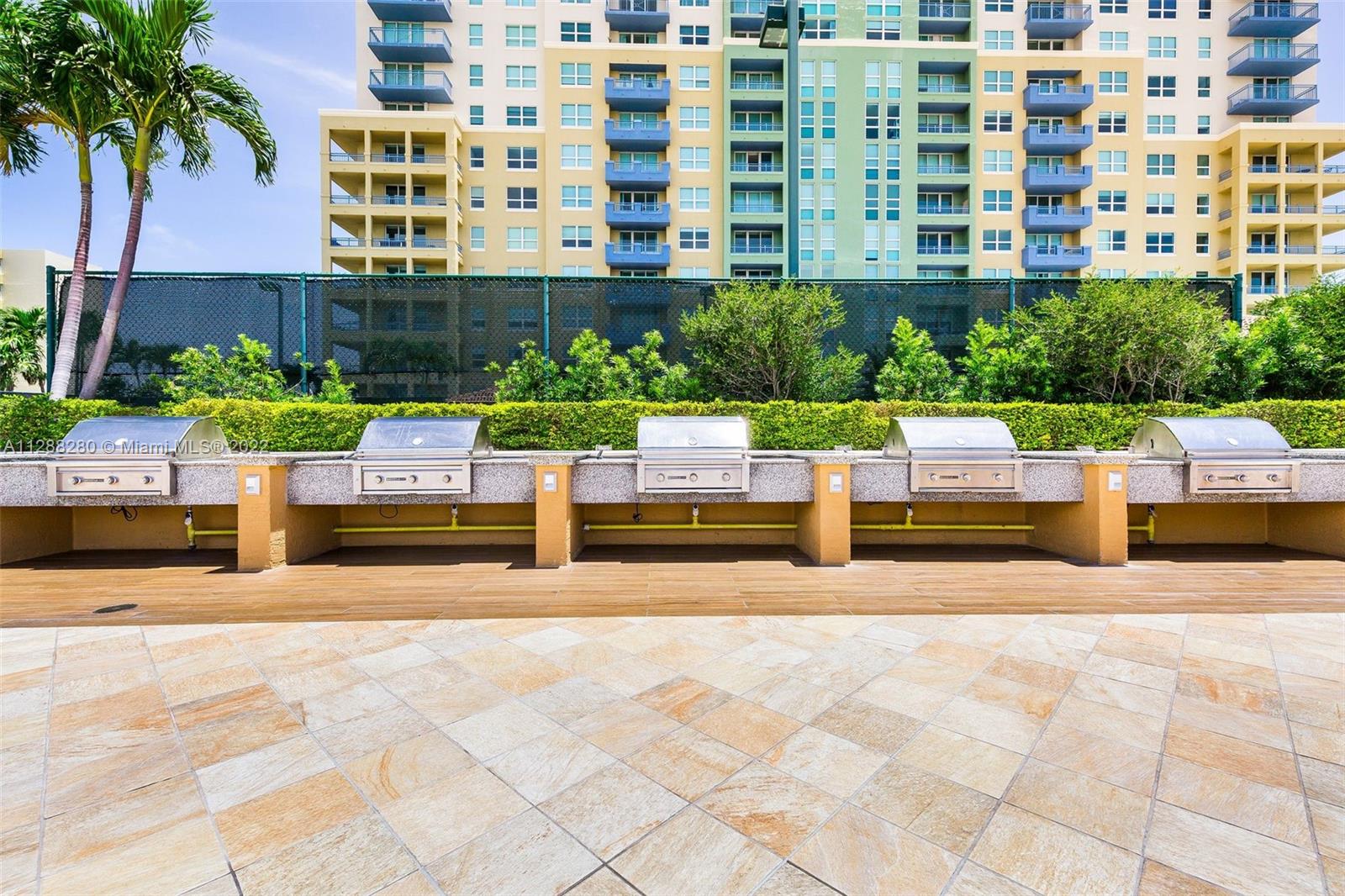 90 Alton Road, Unit 4 Miami Beach, FL 33139 - Photo 18 of 20 a view of building with garden