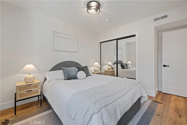 a bedroom with a bed and a lamp