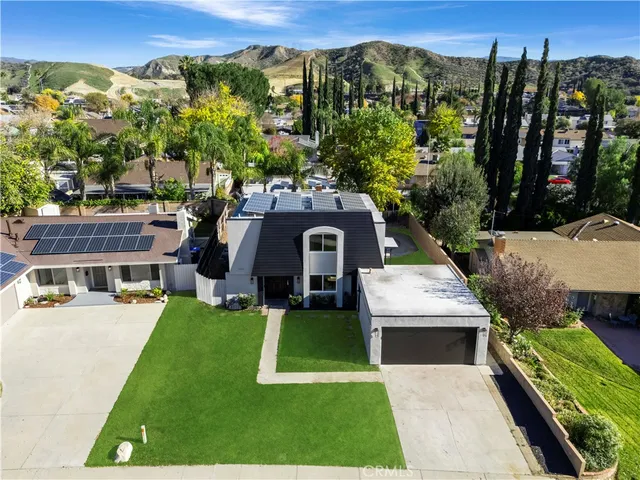 a view of a house with a yard