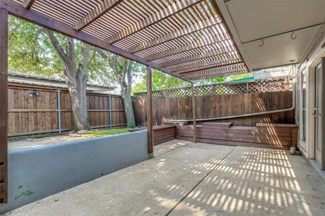 a view of a backyard with table and chairs and wooden floor