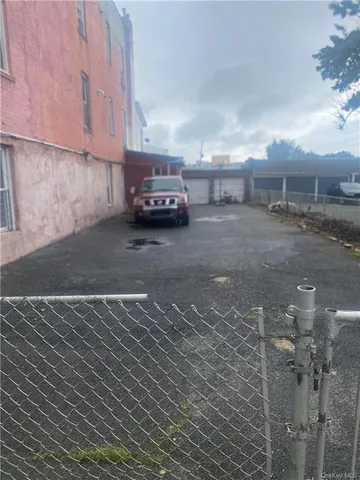 a view of a car park in front of a house