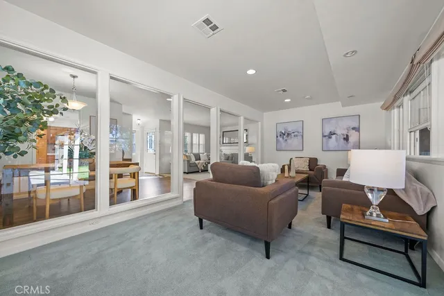 a living room with furniture and a table