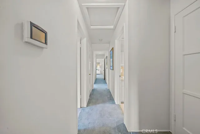 a view of a hallway with a white walls