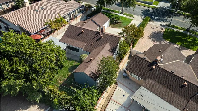 an aerial view of a house with a yard