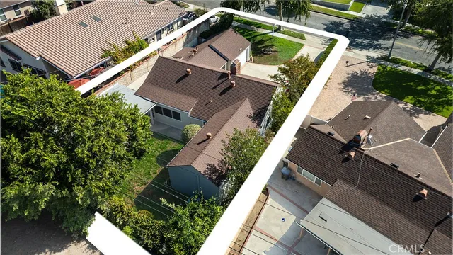 an aerial view of house with yard
