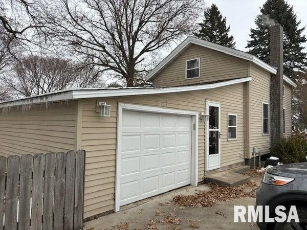 a front view of a house with garage