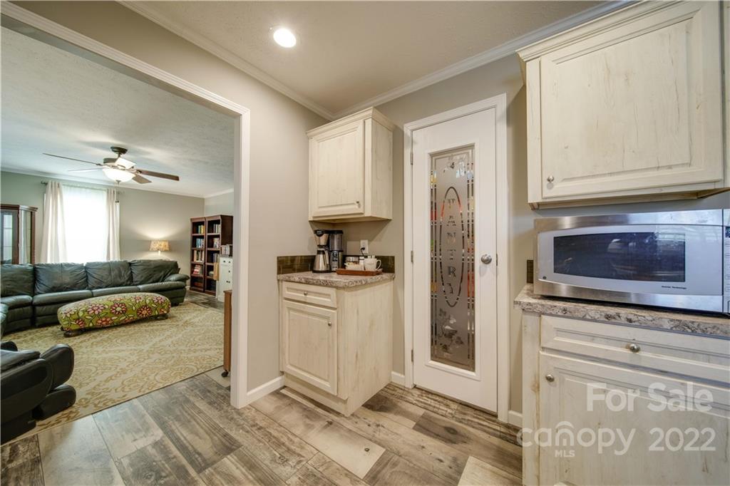 1540 Campbell Road Jefferson, SC 29718 - Photo 13 of 40 a kitchen with stainless steel appliances granite countertop a refrigerator and a stove top oven