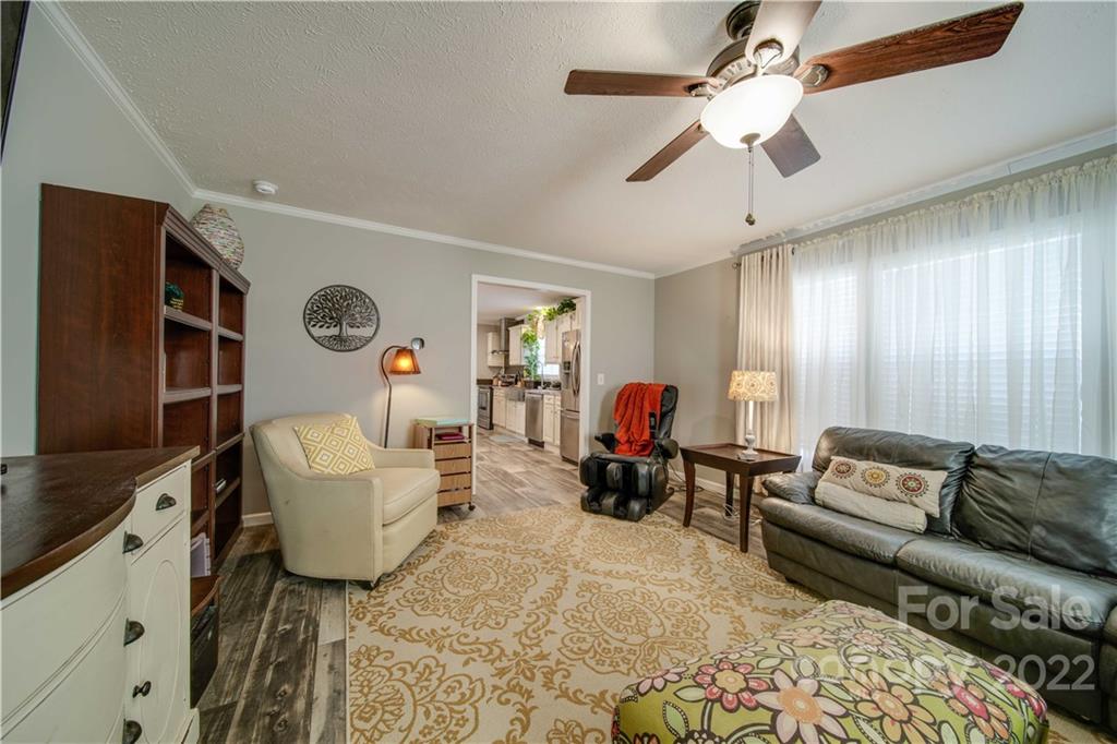 1540 Campbell Road Jefferson, SC 29718 - Photo 15 of 40 a living room with furniture and a flat screen tv