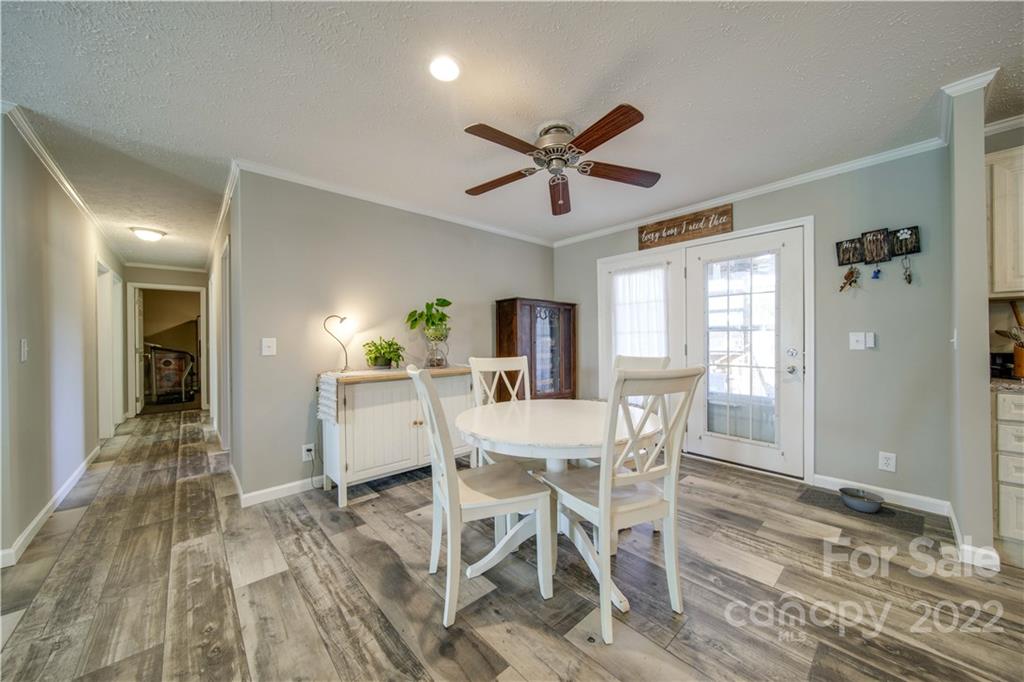 1540 Campbell Road Jefferson, SC 29718 - Photo 17 of 40 a view of a dining room with furniture window and wooden floor