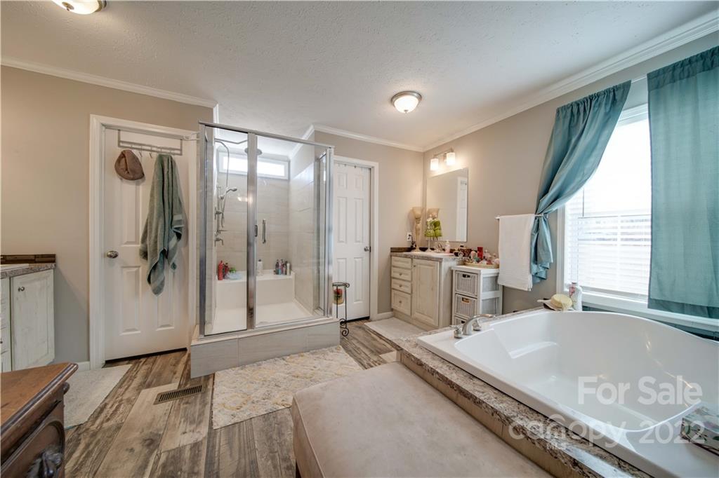 1540 Campbell Road Jefferson, SC 29718 - Photo 20 of 40 a spacious bedroom with a large window and a walk in closet