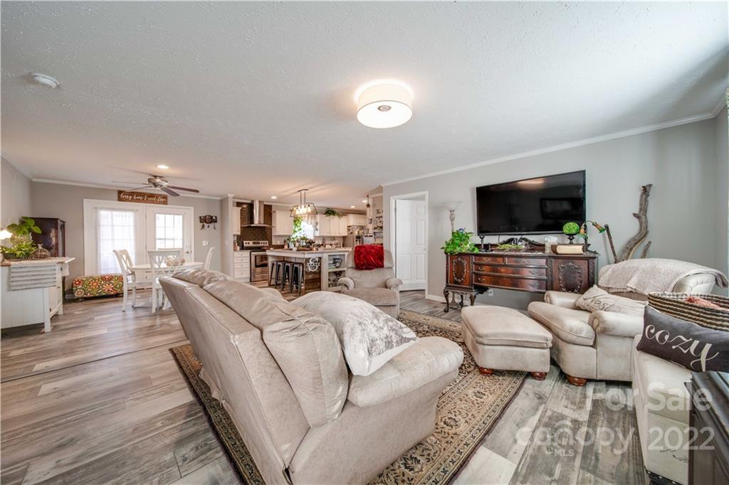 1540 Campbell Road Jefferson, SC 29718 - Photo 2 of 40 a living room with furniture and a flat screen tv