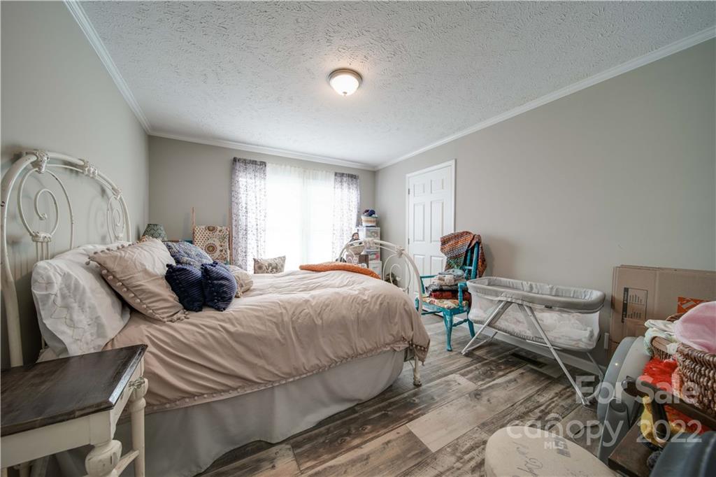 1540 Campbell Road Jefferson, SC 29718 - Photo 22 of 40 a bed room with two bed and a chair