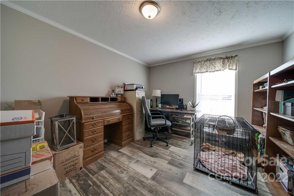 1540 Campbell Road Jefferson, SC 29718 - Photo 24 of 40 a workspace with furniture and a window