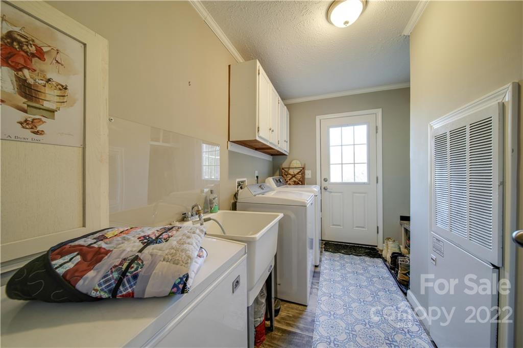1540 Campbell Road Jefferson, SC 29718 - Photo 26 of 40 a bedroom with a bed and a cabinets