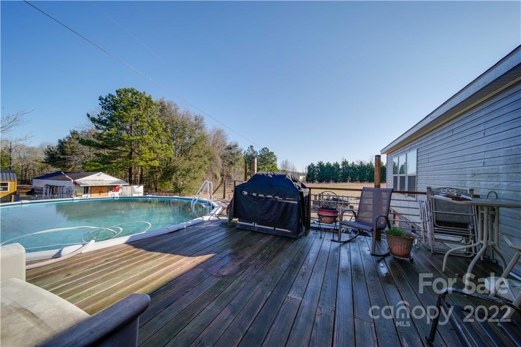 1540 Campbell Road Jefferson, SC 29718 - Photo 27 of 40 a view of a backyard with sitting area