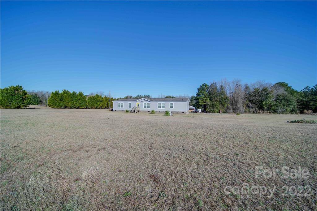 1540 Campbell Road Jefferson, SC 29718 - Photo 34 of 40 a view of a field with trees in background