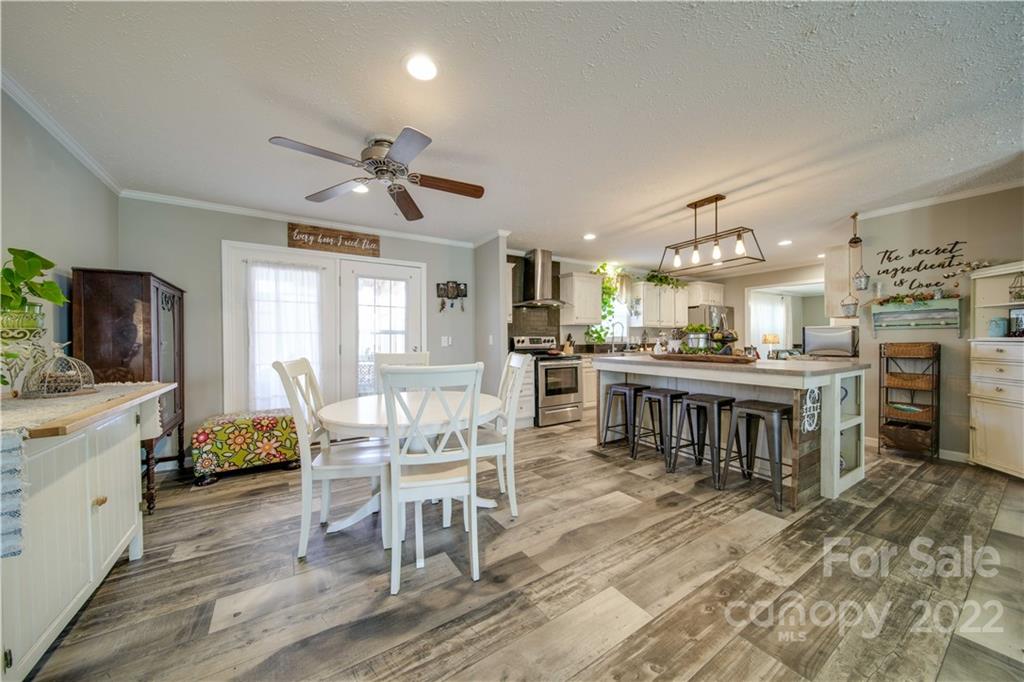 1540 Campbell Road Jefferson, SC 29718 - Photo 5 of 40 a living room with stainless steel appliances kitchen island granite countertop furniture and a kitchen view