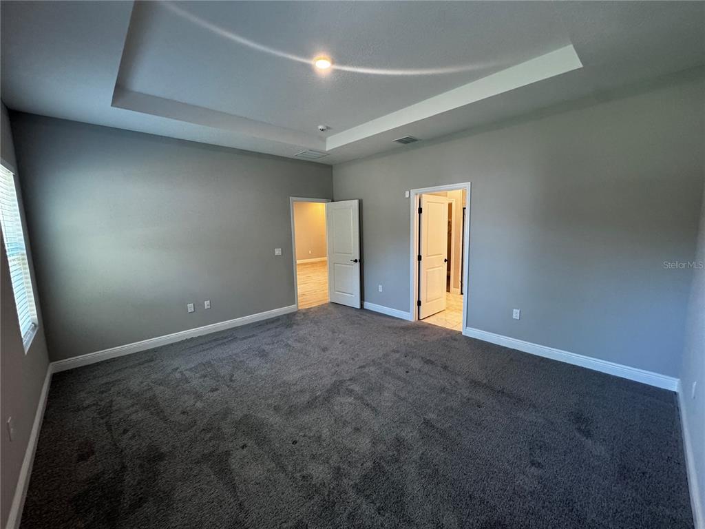 13101 Southwest 72nd Terrace Road Ocala, FL 34473 - Photo 7 of 18 a view of an empty room with a window