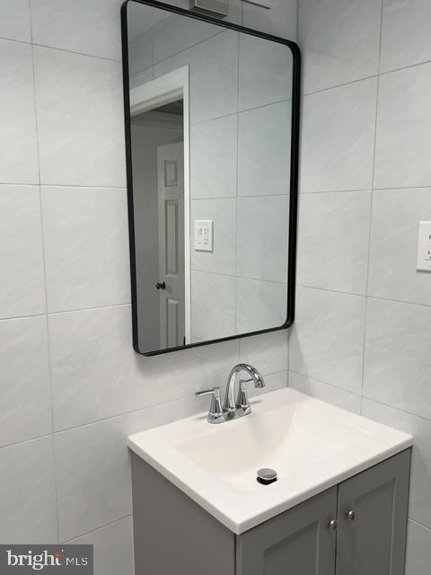 631 Anchor Street Philadelphia, PA 19120 - Photo 16 of 18 a bathroom with a sink and a mirror