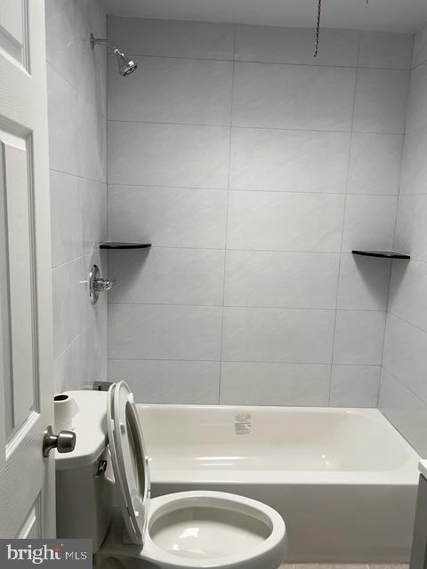 631 Anchor Street Philadelphia, PA 19120 - Photo 17 of 18 a bathroom with a sink a toilet and bathtub