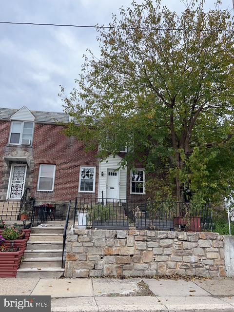 631 Anchor Street Philadelphia, PA 19120 - Photo 3 of 18 a front view of a house with a tree