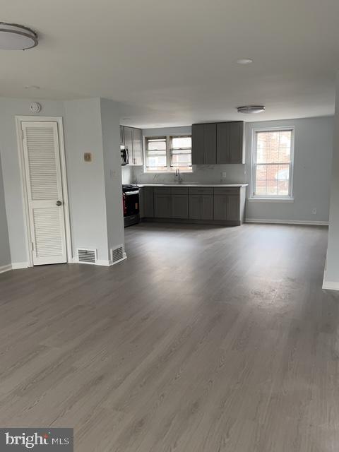 631 Anchor Street Philadelphia, PA 19120 - Photo 6 of 18 a view of wooden floor and windows in a room